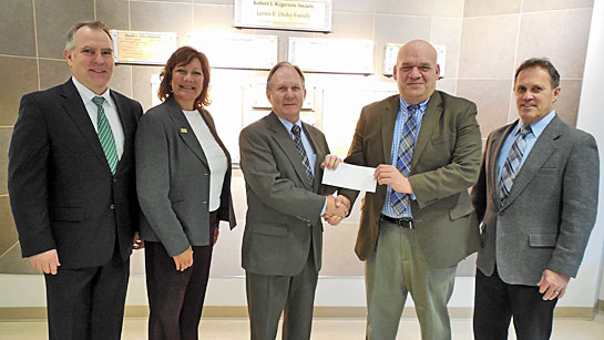 Shown are (from the left) CNB Business Banking Officer Chris Dippold, Western Ohio Educational Foundation Development Officer Julie Miller, CNB President CEO Mike Romey (handing the check to Dr. Jay Albayyari, dean/chief administrative officer of WSU-Lake Campus), CNB Senior Vice President Rod Stover of the Celina banking office. (WSU-LC photo)