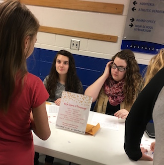 Senior FCCLA members sell roses before school for the “Roses for Richey” fundraiser. The roses were delivered on Tuesday of FCCLA week during Knight Time. (Photo submitted.)