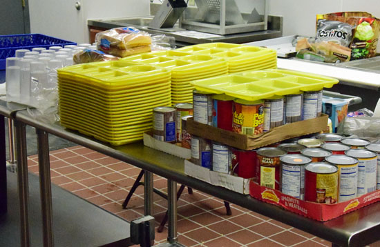 The beans, hot dog buns, and serving ware were on the table of the Salvation Army kitchen on Tuesday in preparation for today's first Wednesday luncheon. Dave Mosier/Van Wert independent