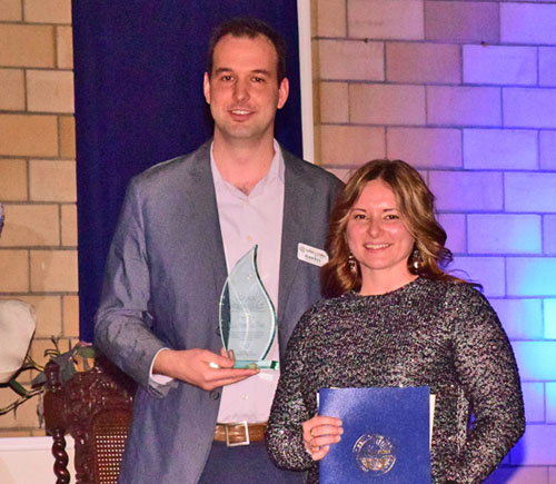 Main Street Van Wert Program Director Adam Ries and Board member Ty Coil with the Chamber's Crystal Image Award. Dave Mosier/Van Wert independent