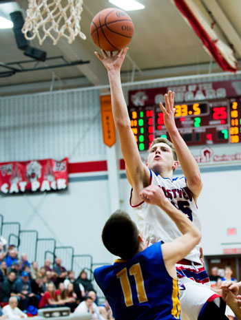 Crestview's Javin Etzler (15) scores over Lancer Chayten Overholt (11) during Saturday's Division IV sectional title game at Van Wert. Bob Barnes/Van Wert independent