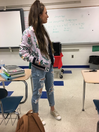 Sophomore Chelsea Taylor wears ripped jeans on “Holy Tuesday” NHS’ theme week as a fundraiser for the KAH event. (Photo submitted.)