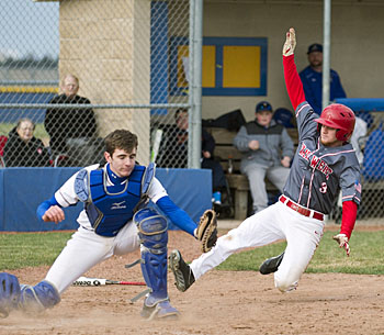 Van Wert's Mason Carr (3) slides into home plate while Lincolnview catcher waits for the ball during Wednesday's contest won by the Cougars. Bob Barnes/Van Wert independent