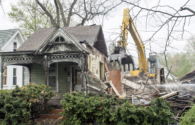 Just a small portion of the house remains as demolition proceeds on Friday. Bob Barnes/Van Wert independent