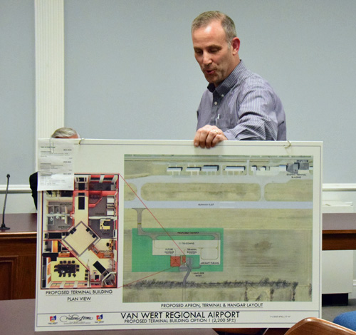 Van Wert Regional Airport Authority member Mike Keysor holds a map showing planned airport improvements during Monday's Van Wert City Council meeting. Dave Mosier/Van Wert independent