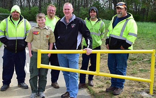 Cole Gorman poses with Van Wert Safety-Service Director Jay Fleming (in dark coat) and several Van Wert Street Department workers. Dave Mosier/Van Wert independent