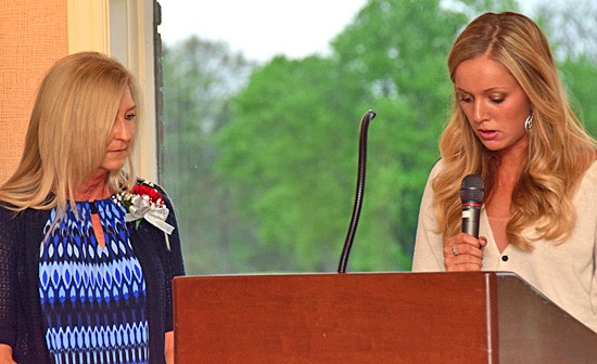 One of Van Wert High School's top seniors, Cassidy Sinning (right) reads her letter honoring teacher Kathleen Overmyer. photos by Dave Mosier/Van Wert independent