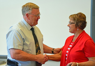 Crestview Superintendent Mike Estes presents retiring Food Service Supervisor Mary Strickler a plaque honoring her 30 years of service to the district. Dave Mosier/Van Wert independent