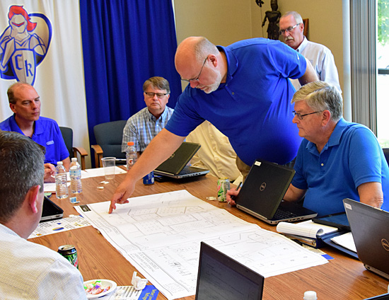 Brad Garmann of Germann Miller & Associates points out features of a master site plan the Minster-based architectural firm developed for Crestview. Dave Mosier/Van Wert independent