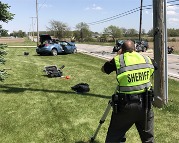 A deputy from the Van Wert County Sheriff's Office uses a laser system to reconstruct the scene of an accident that occurred Sunday morning on Ohio 81 near Willshire. (VWSO photo)
