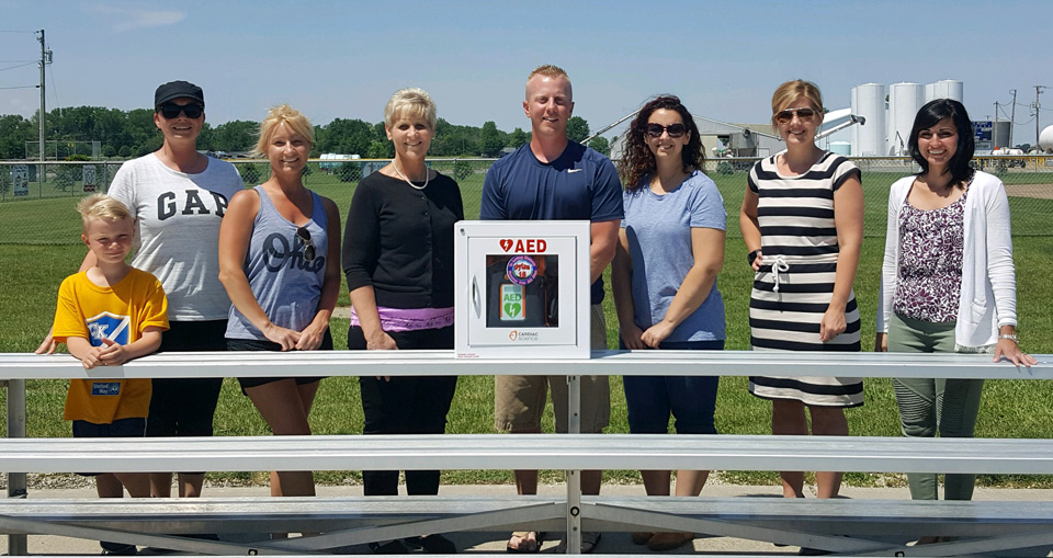 Shown with the new AED machine are United Way and Middle Point Ballpark representatives (from the left) Adam Miller, Amanda Miller, Kristen Dunlap, Vicki Smith, Kevin Price, Heather Brickner, Jessica Hardesty, and Jessica Longstreth. (photo submitted)
