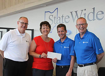 Statewide Ford Lincoln makes a donation to provide Van Wert County school students with free backpacks, school supplies, and other back to school essentials. Presenting Julie Burenga from Operation Back to School and Van Wert First United Methodist Church are Steve Munroe, Brad Greve, and Andy Czajkowski. (photo submitted)